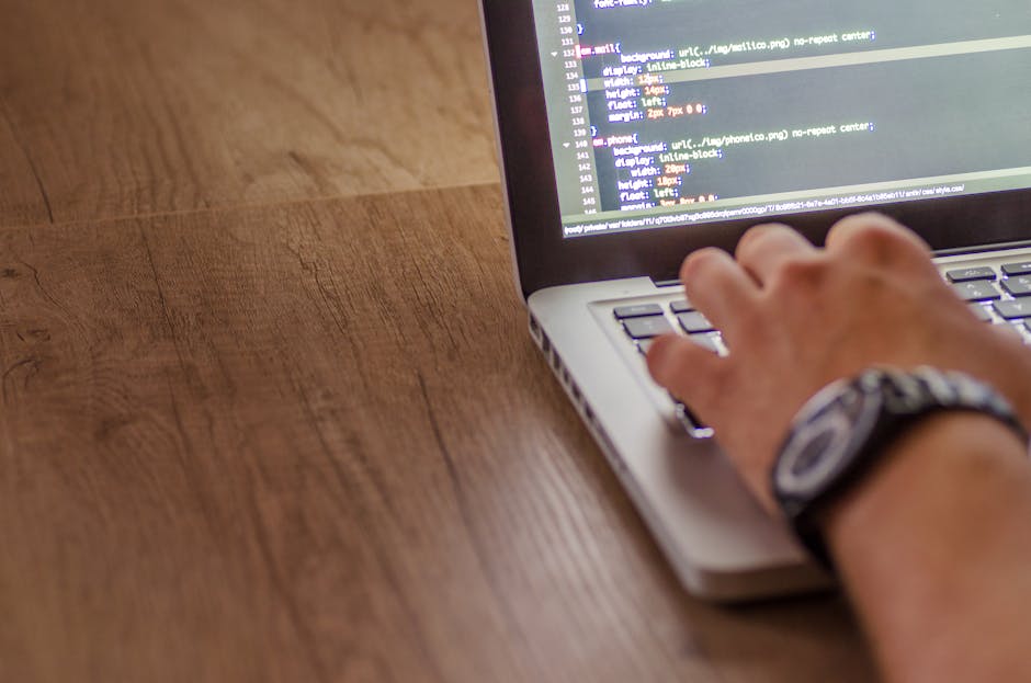 A close-up of a computer screen displaying a code editor with multicolored lines of HTML and CSS code on a dark background, highlighting the intricate details of web development related to online gard